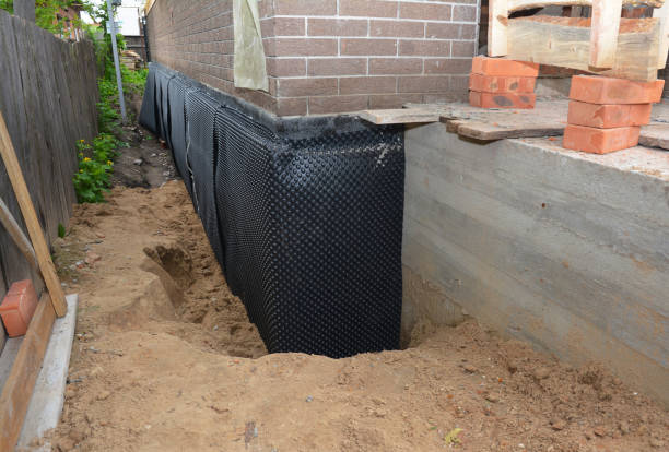 SJ Waterproofing Pros technician performing targeted Sump Pump Installation assessment in Fort Atkinson, WI